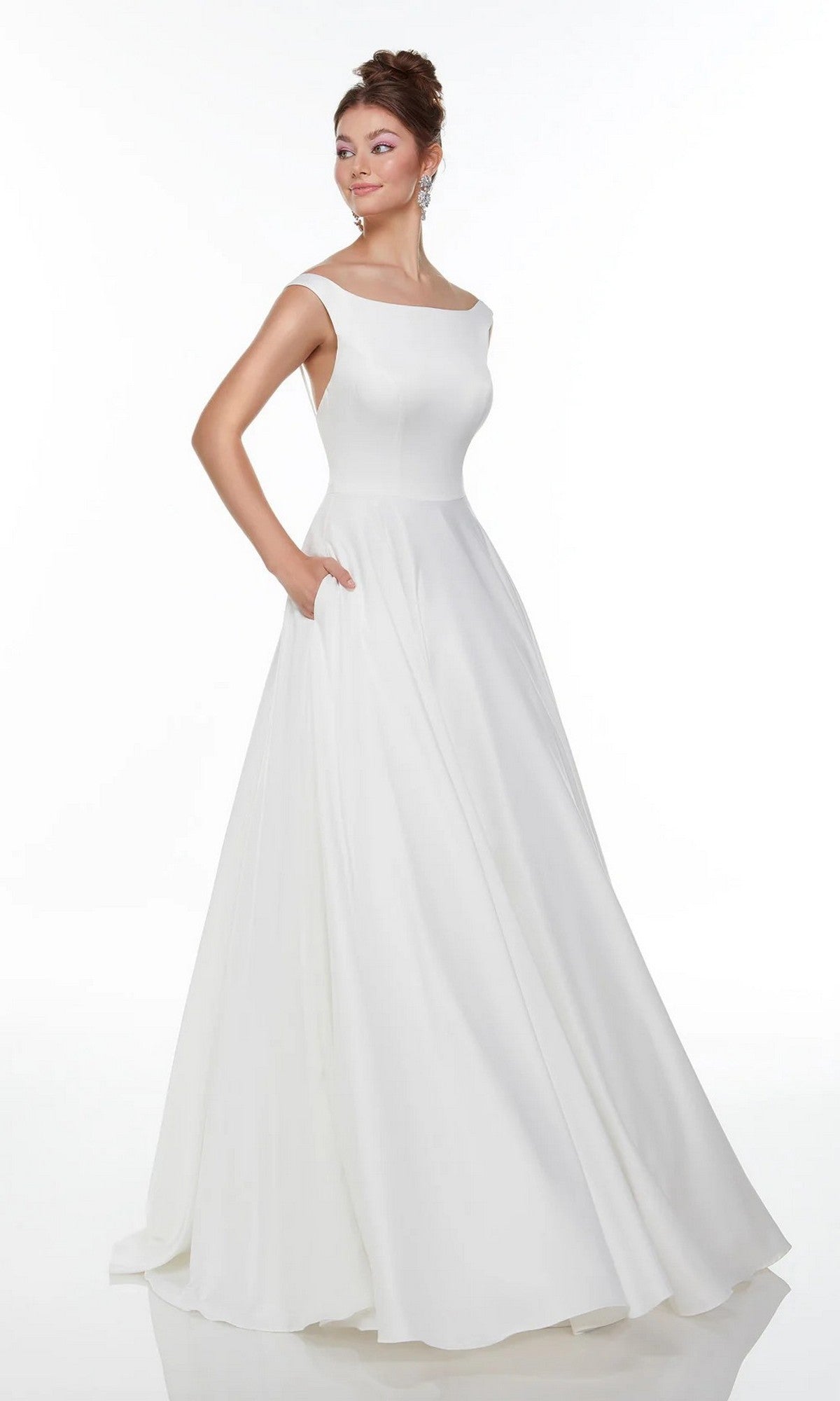 A woman stands against a plain white background, modeling the Alyce 7053: a sleeveless, floor-length white satin dress with an A-line skirt, boat neckline, and pockets.